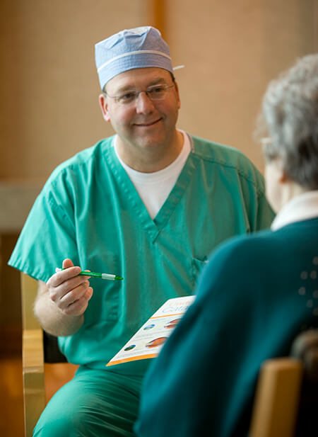 Dr. Holland Speaking to a Patient